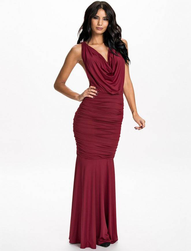 Make a Statement: Model Wearing Ruby Red Halter Dress by Rachael K