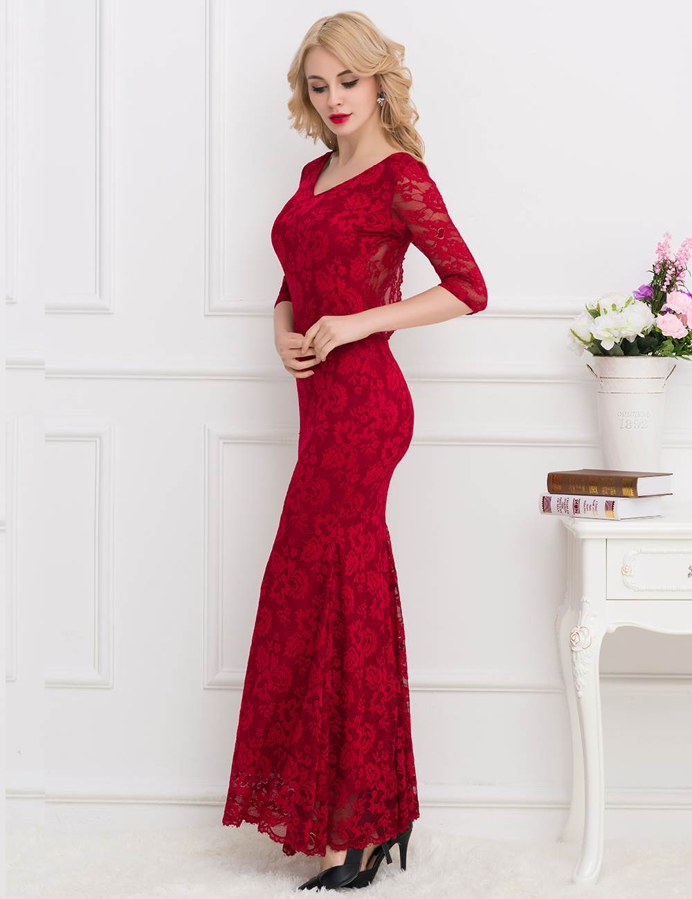 Floor-length ruby red evening dress with delicate lace details, perfect for galas and special events.
