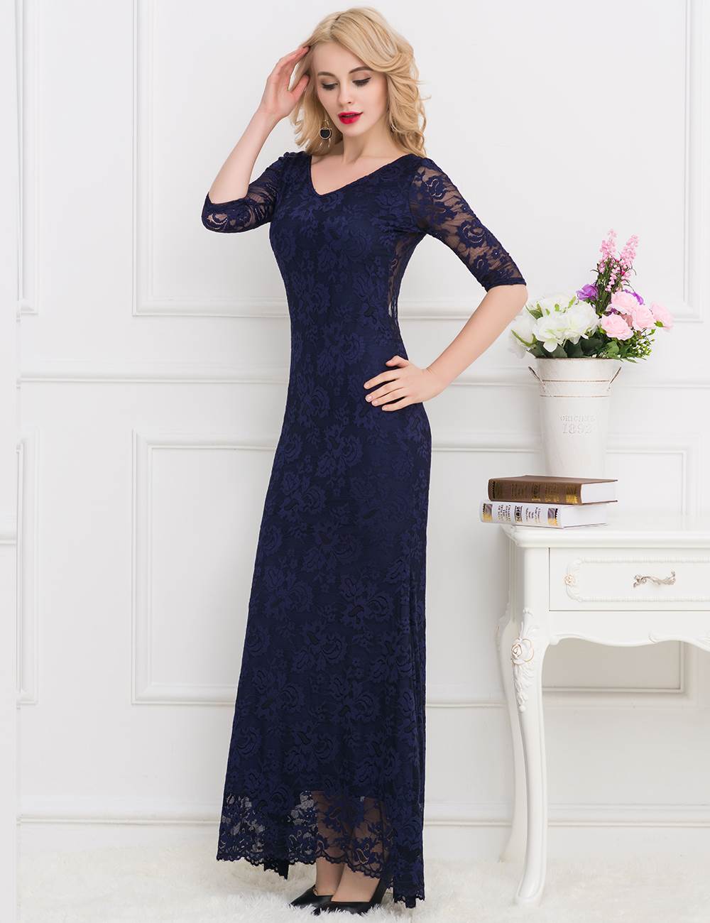 Navy blue lace gown with a flattering cut and open-back design, ideal for gala nights.